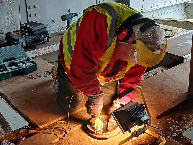 Geoff grinding the remaing shell of the central wrought iron adjuster Geoff grinding the remaing shell of the central wrought iron adjuster